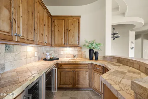 a bathroom with a toilet and a mirror