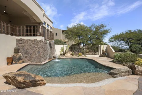a view of a house with a tub and a fire pit