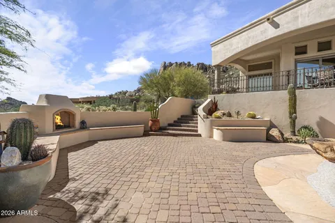 a view of a terrace with furniture and a potted plant