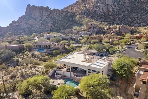 a view of roof deck with couches and sky view