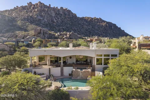 a view of a house with a mountain ground