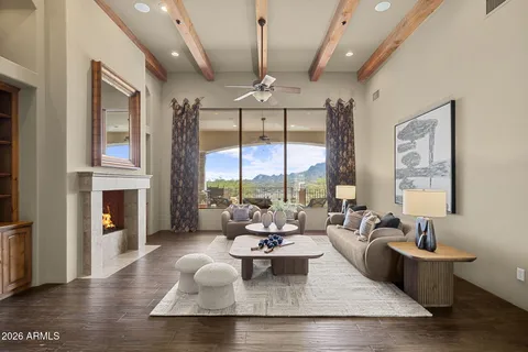 a view of a house with a yard and sitting area