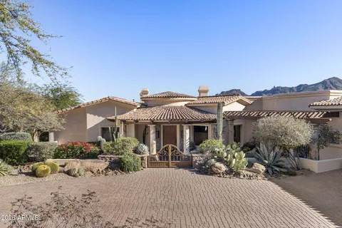 a kitchen with stainless steel appliances granite countertop a stove a sink dishwasher a microwave oven with a dining table and chairs