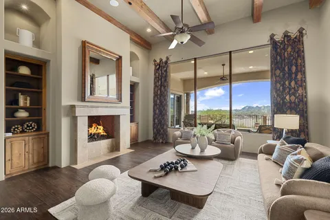 a view of a house with backyard and sitting area