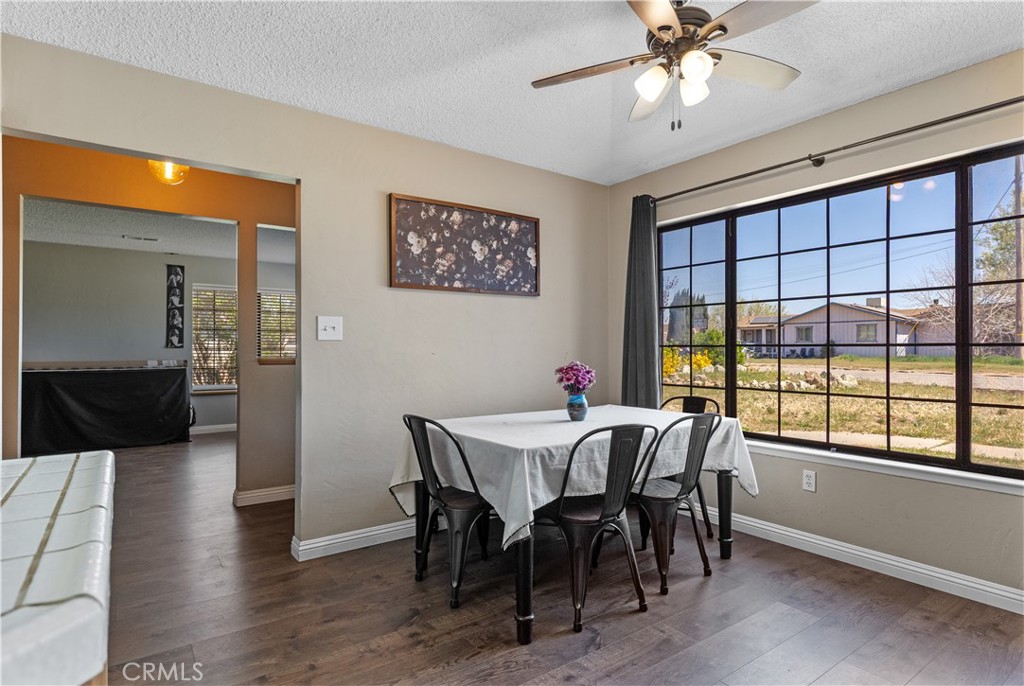21921 Fig Court Tehachapi, CA 93561 - Photo 14 of 44 a view of a dining room with furniture window and wooden floor