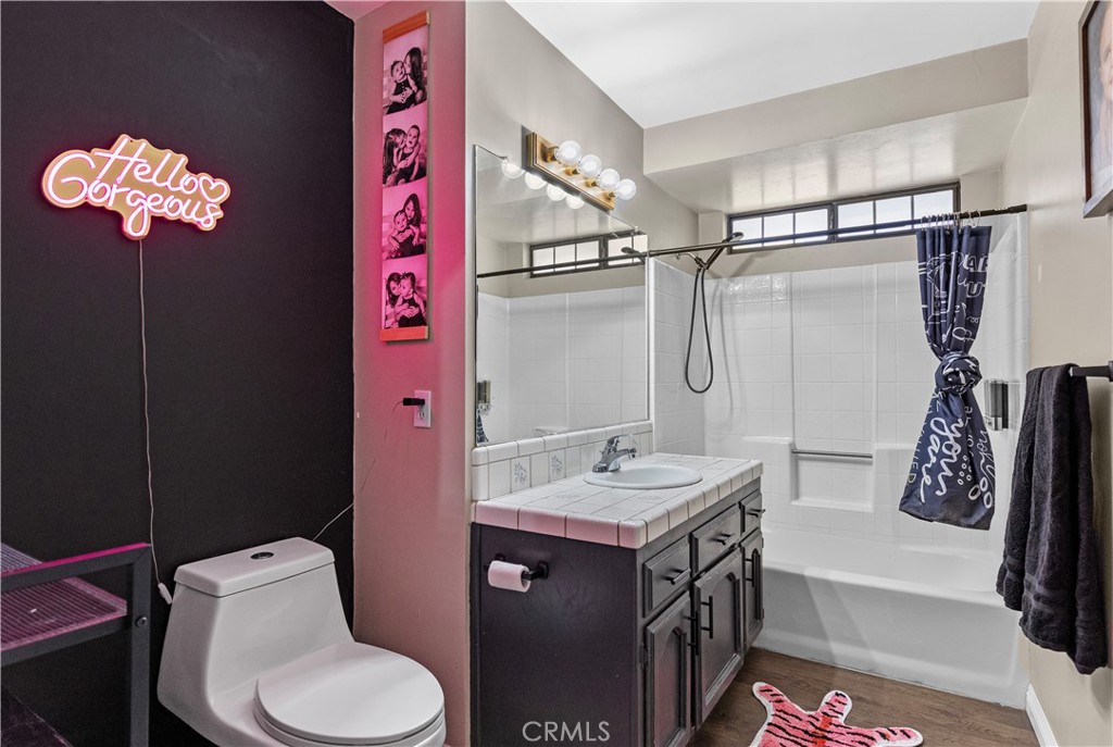 21921 Fig Court Tehachapi, CA 93561 - Photo 21 of 44 a bathroom with a sink vanity mirror bathtub and toilet