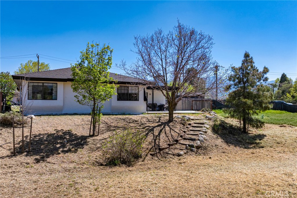 21921 Fig Court Tehachapi, CA 93561 - Photo 40 of 44 a front view of a house with a yard