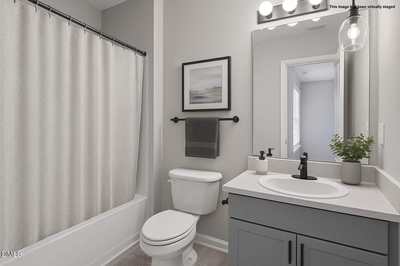 1601 Briarmont Court Raleigh, NC 27610 - Photo 25 of 30 a bathroom with a sink toilet and shower