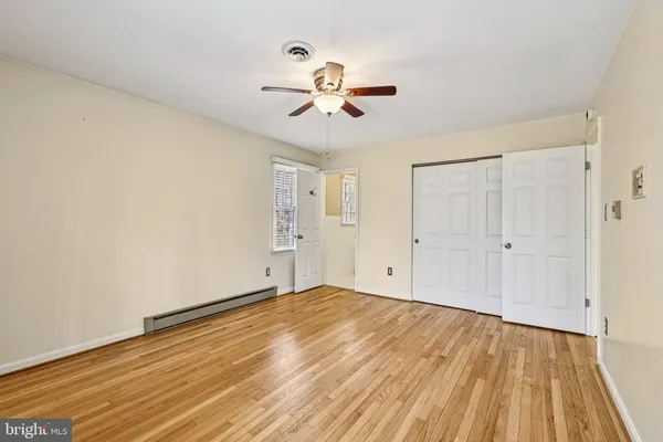 a bathroom with a sink toilet and a mirror