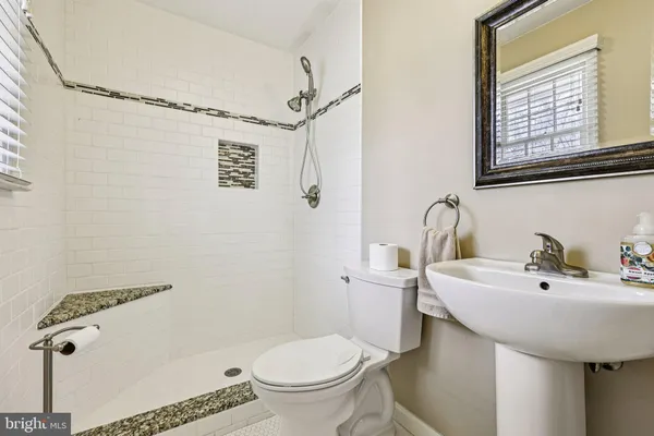 a view of an empty room and fire place