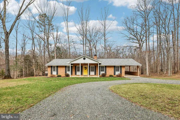 a view of a road with snow on the roadside