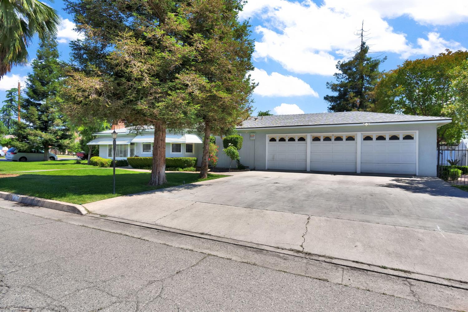 200 Lyons Street Madera, CA 93638 - Photo 2 of 32 a front view of a house with a yard