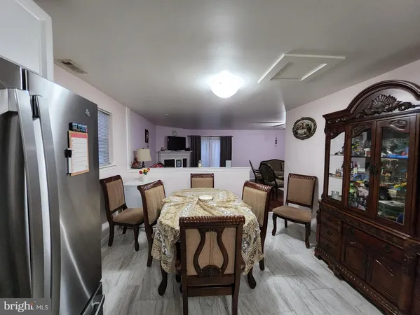 a view of a dining room with furniture and window