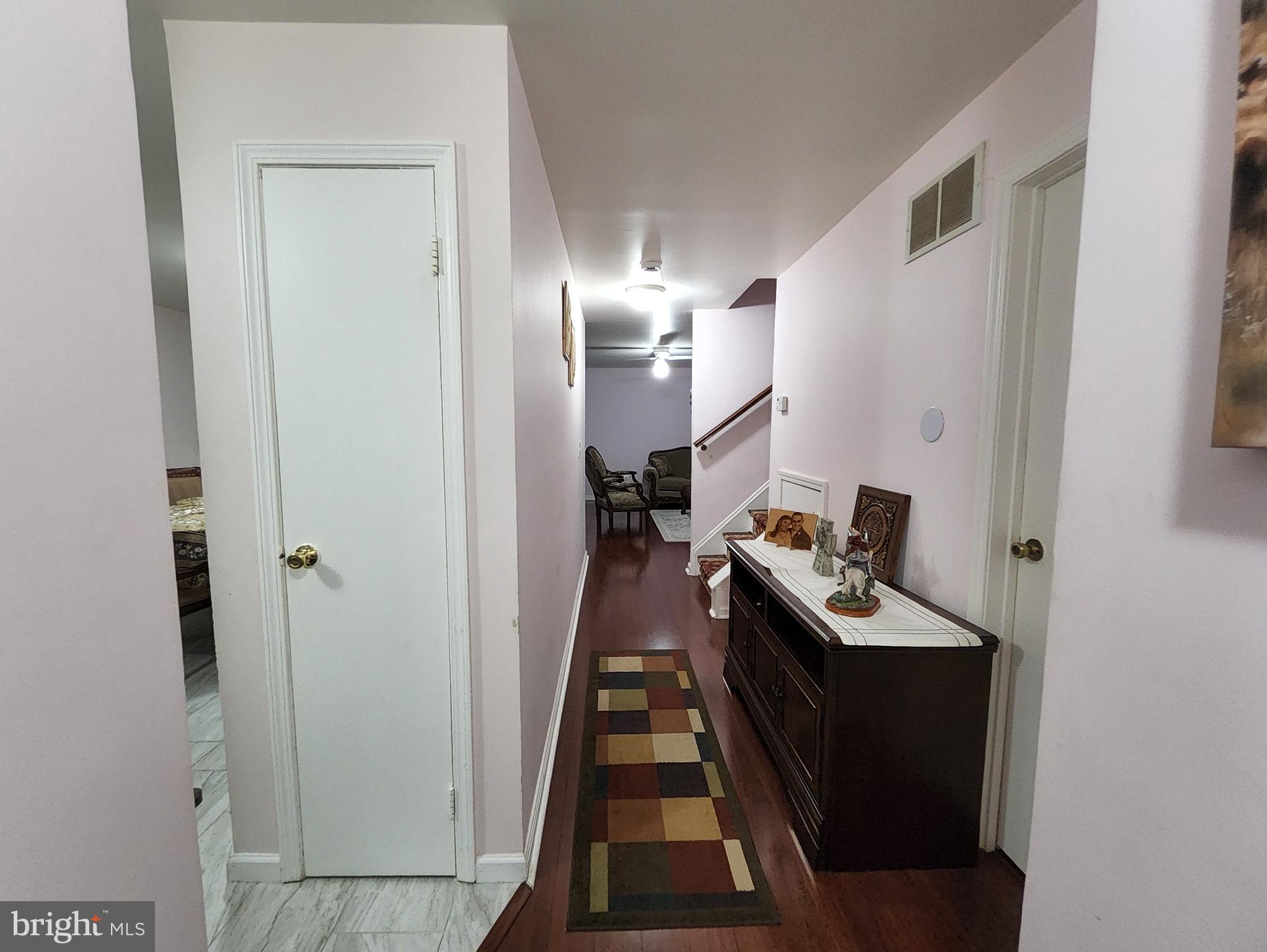 2 Adam Court Eastampton, NJ 08060 - Photo 16 of 34 a hallway with white cabinets and black appliances
