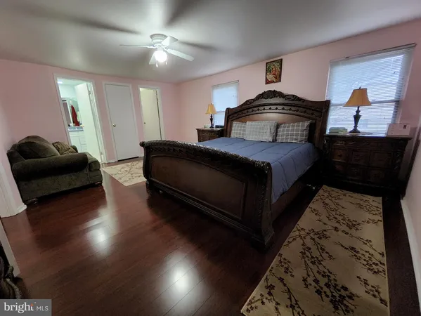 a bedroom with bed and window