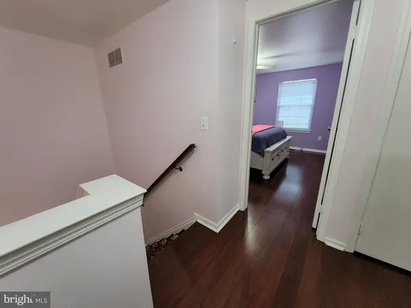 a hallway with wooden floor