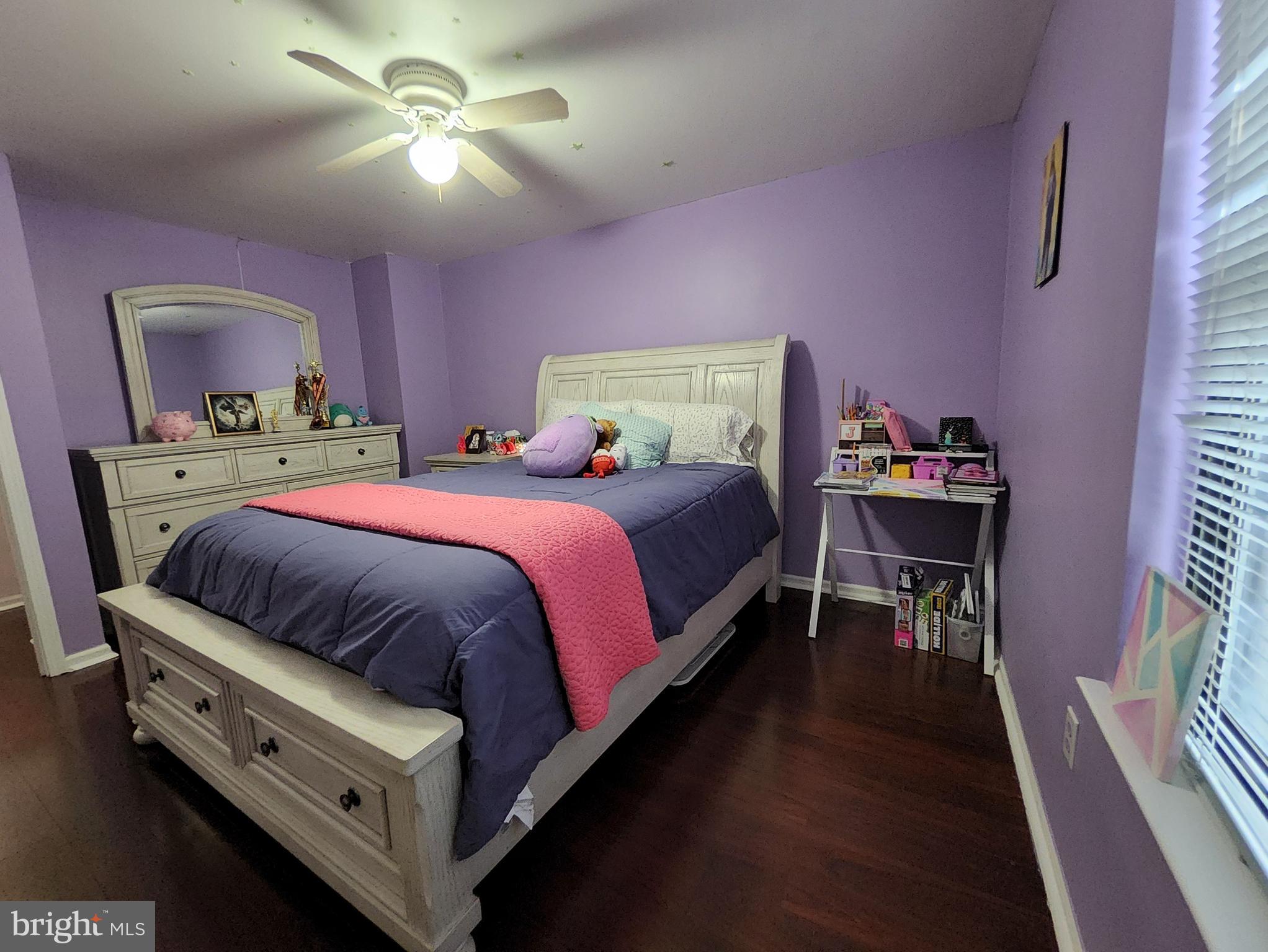 2 Adam Court Eastampton, NJ 08060 - Photo 30 of 34 a bedroom with a bed and a chandelier