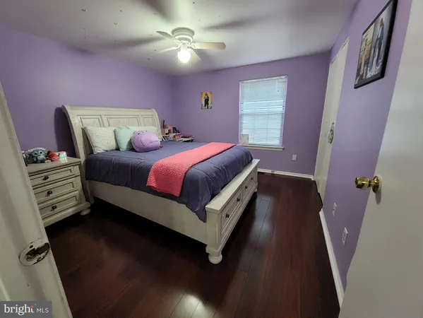 a bed room with a bed and a chandelier
