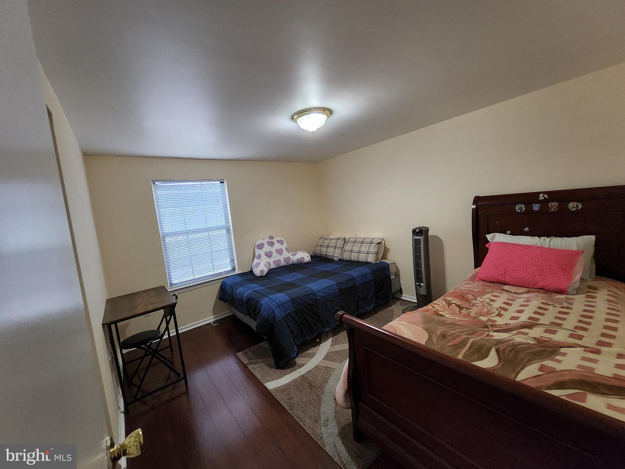 2 Adam Court Eastampton, NJ 08060 - Photo 33 of 34 a bedroom with two beds and a lamp on desk