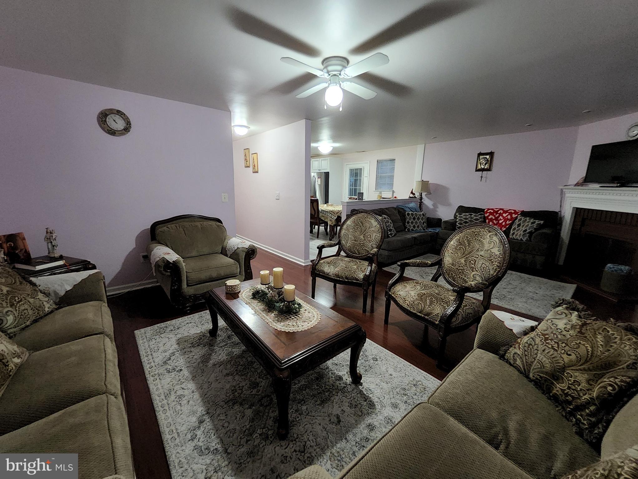 2 Adam Court Eastampton, NJ 08060 - Photo 5 of 34 a living room with furniture a rug and a chandelier