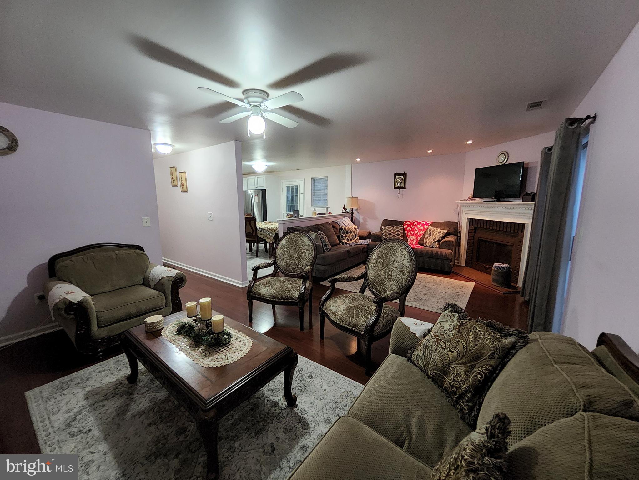 2 Adam Court Eastampton, NJ 08060 - Photo 6 of 34 a living room with furniture and a fireplace
