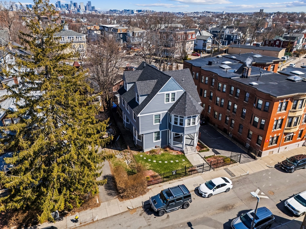 7 Waumbeck Street, Unit 3 Boston, MA 02121 - Photo 21 of 21 a view of a city with tall buildings