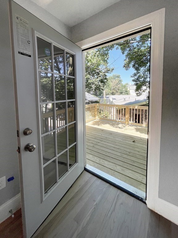 7 Waumbeck Street, Unit 3 Boston, MA 02121 - Photo 5 of 21 a view of a porch with wooden floor and a window