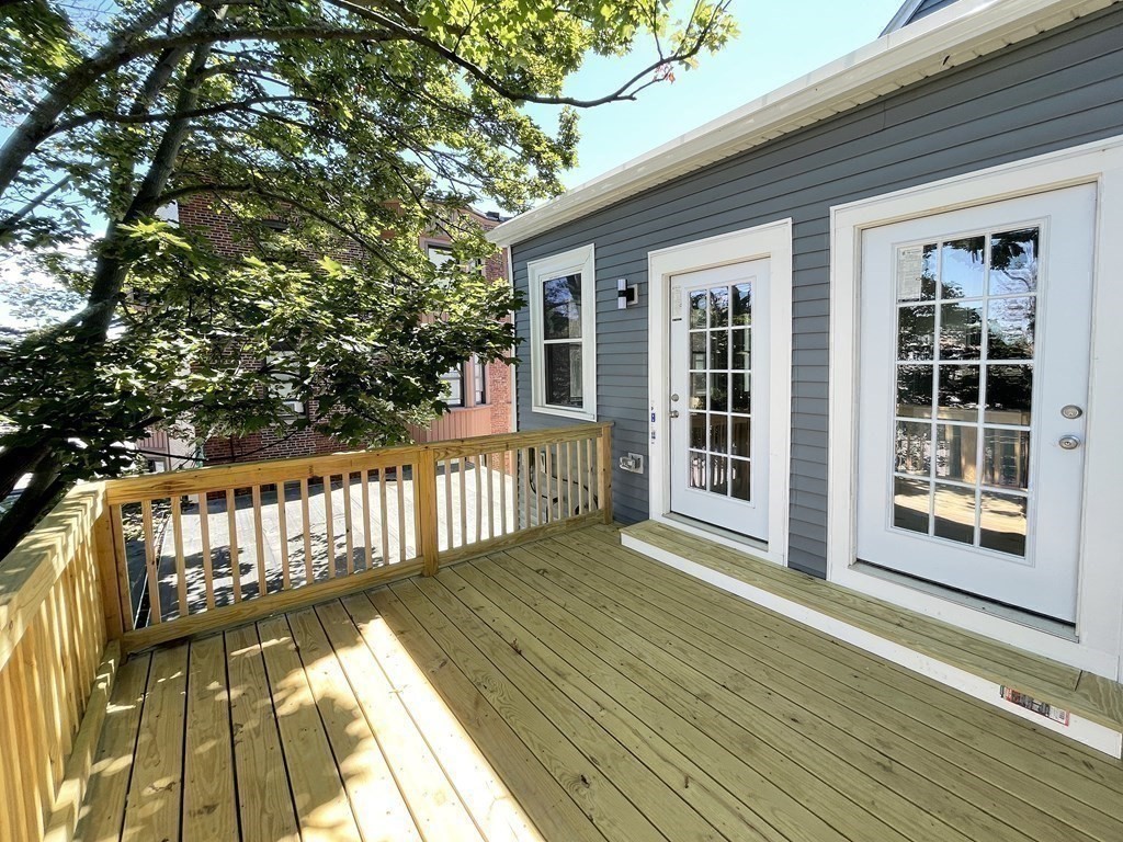 7 Waumbeck Street, Unit 3 Boston, MA 02121 - Photo 6 of 21 a view of balcony with wooden floor