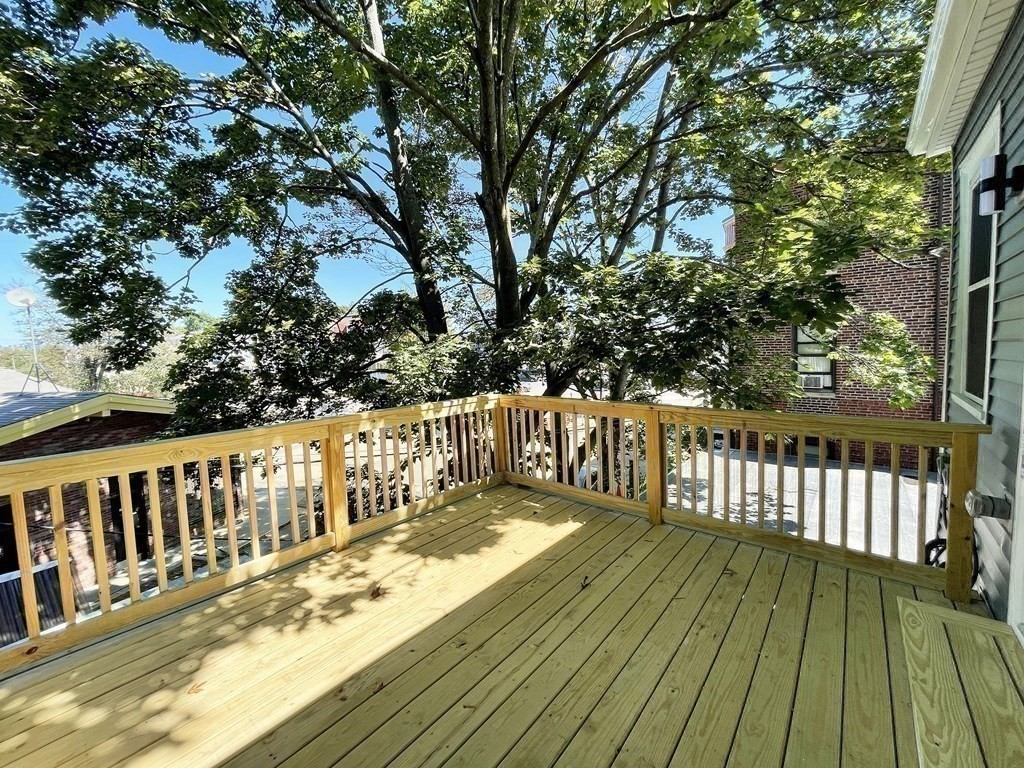 7 Waumbeck Street, Unit 3 Boston, MA 02121 - Photo 7 of 21 a view of wooden deck