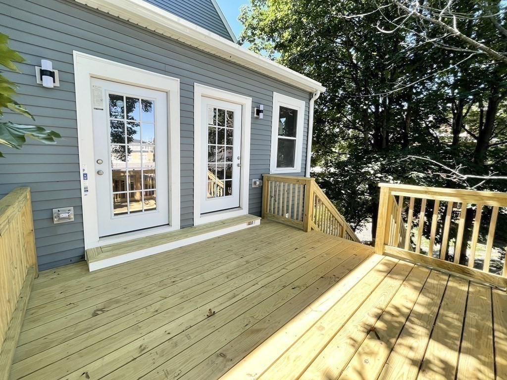 7 Waumbeck Street, Unit 3 Boston, MA 02121 - Photo 8 of 21 a view of a house with wooden deck