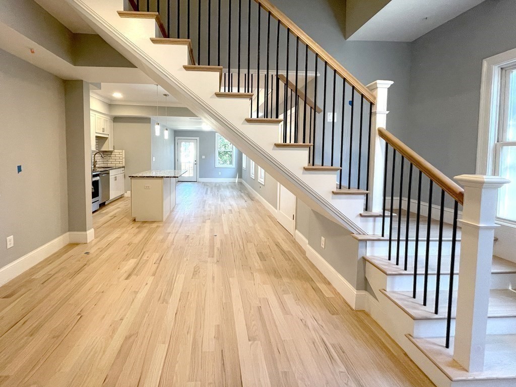 7 Waumbeck Street, Unit 3 Boston, MA 02121 - Photo 9 of 21 a view of entryway and hall with wooden floor