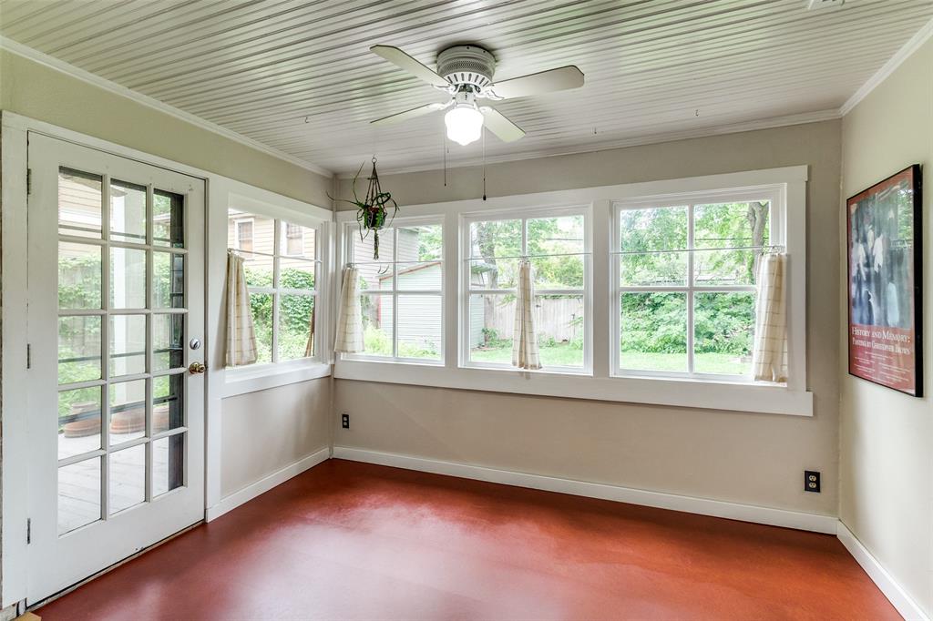 5020 Junius Street Dallas, TX 75214 - Photo 15 of 31 a view of an empty room with a window and wooden floor