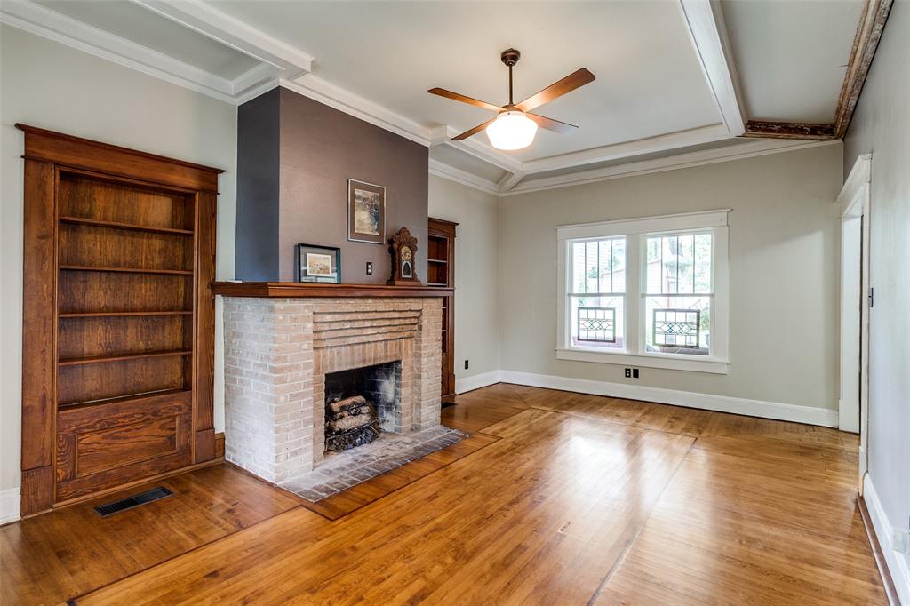5020 Junius Street Dallas, TX 75214 - Photo 7 of 31 a view of an empty room with a fireplace and a window