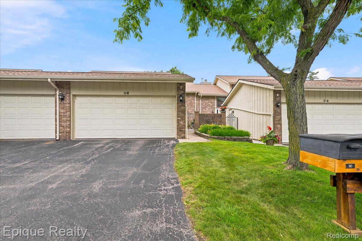 26 Kirks Court Rochester, MI 48309 - Photo 2 of 44 Asphalt driveway with direct access to a two-car garage