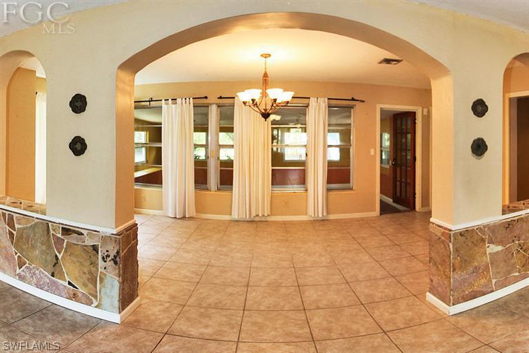 1806 Ardmore Road Fort Myers, FL 33901 - Photo 1 of 11 a view of a hallway with windows