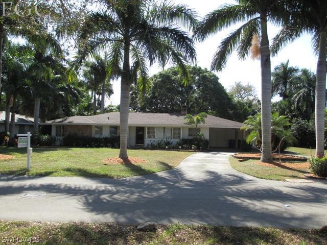 1806 Ardmore Road Fort Myers, FL 33901 - Photo 11 of 11 a front view of a house with garden and trees