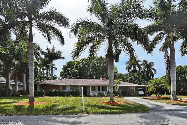 1806 Ardmore Road Fort Myers, FL 33901 - Photo 2 of 11 a view of a house with swimming pool and palm trees