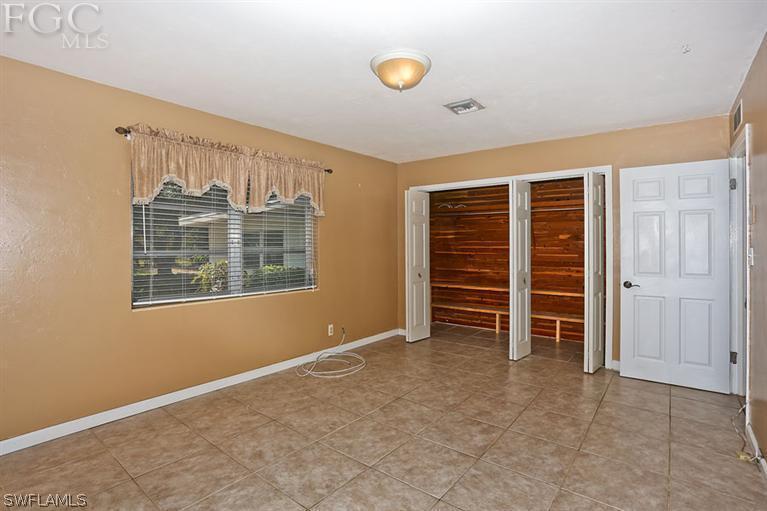 1806 Ardmore Road Fort Myers, FL 33901 - Photo 6 of 11 a view of an empty room with a window and closet