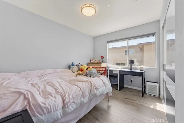 a bed room with a bed and a window