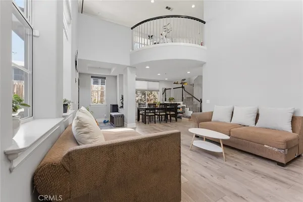 a living room with furniture a table and chairs