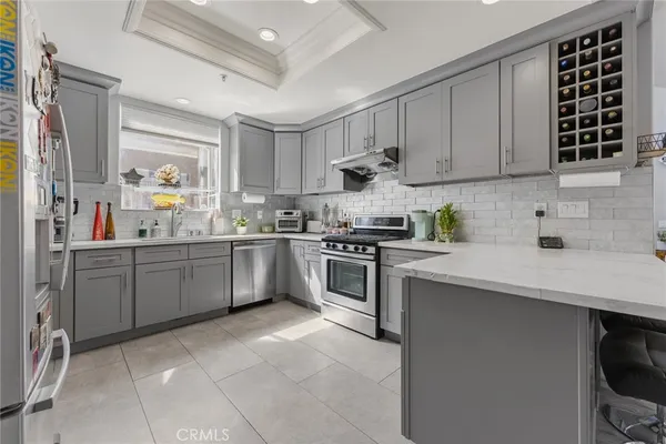 a kitchen with cabinets and window