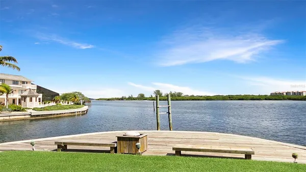 a view of house with garden space and swimming pool