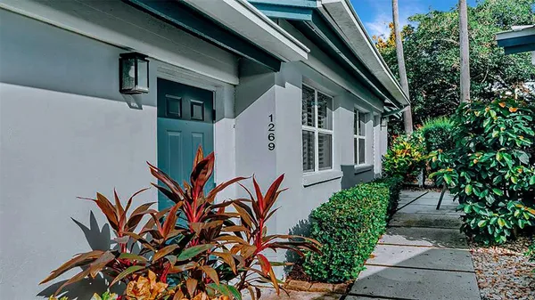 a living room with furniture a window and a couch