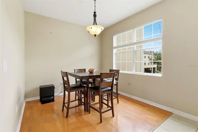 a dining room with furniture and window
