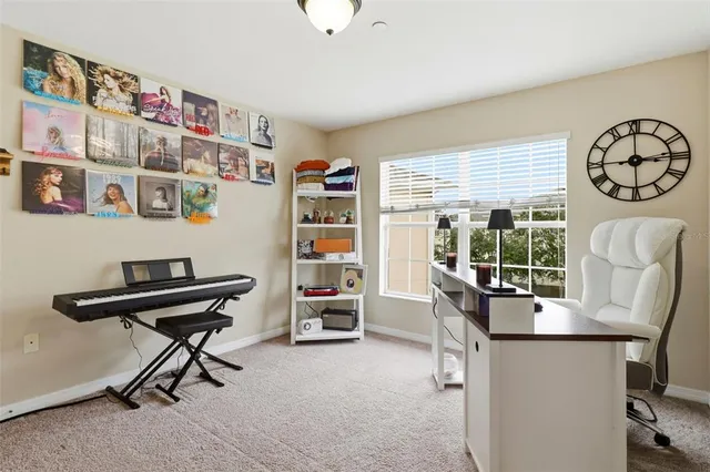 a view of a livingroom with furniture and a window