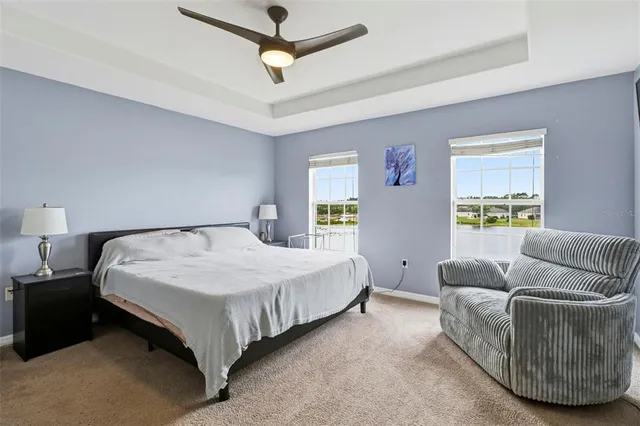 a bedroom with a bed couch and window