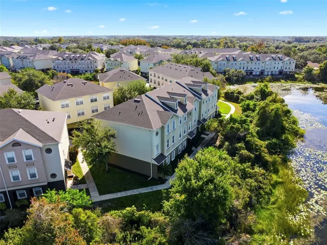 an aerial view of a house with a lake view