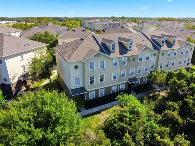 an aerial view of residential houses with outdoor space