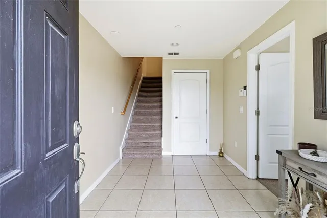 a view of a livingroom with an empty space and a hallway