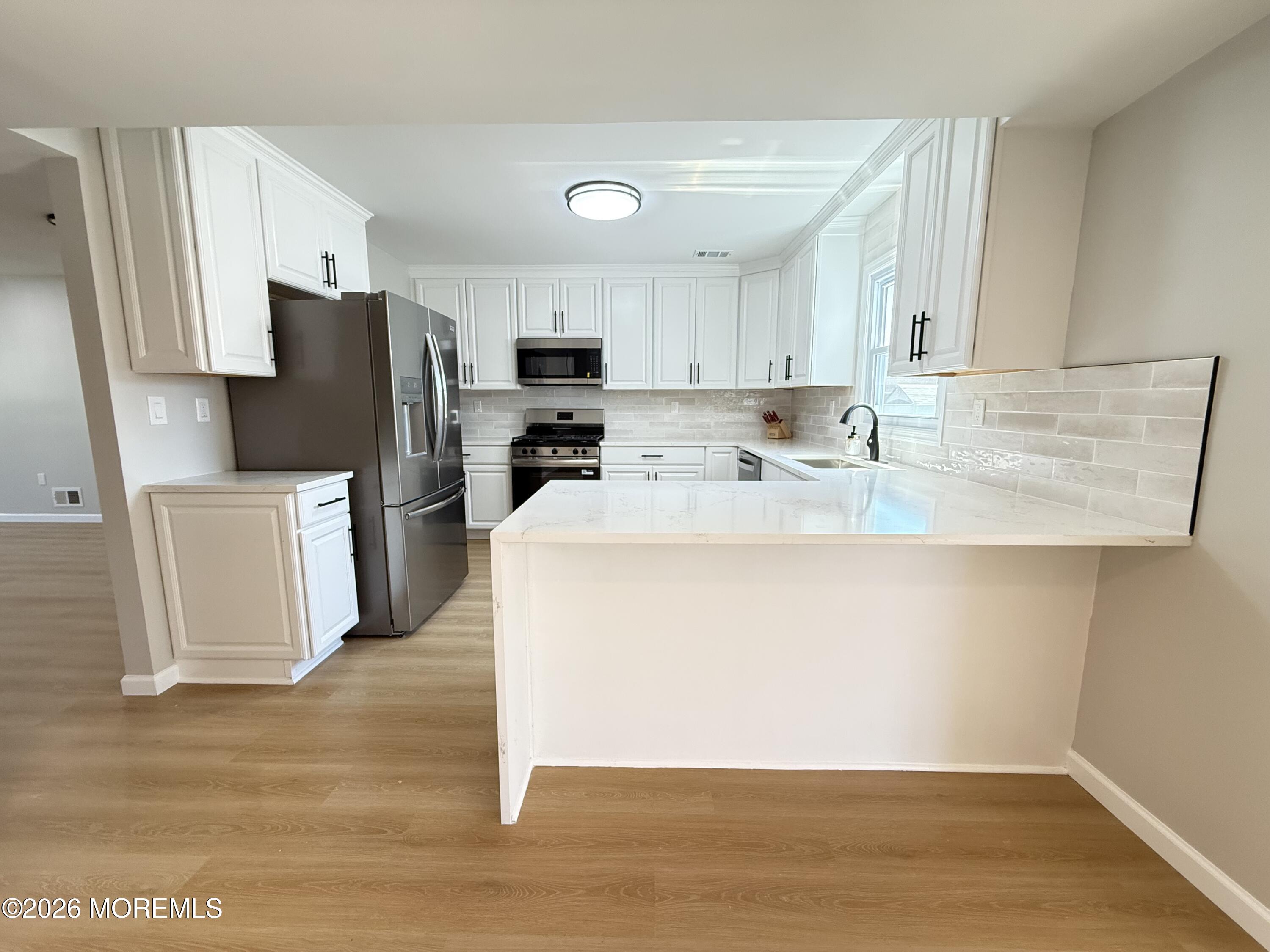 21 Queen Ann Road Brick, NJ 08723 - Photo 10 of 36 Kitchen Breakfast Bar
